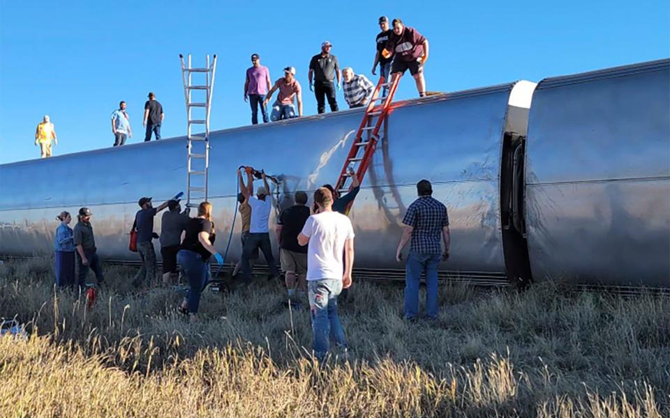 People work at the scene of an Amtrak train derailment in north-central Montana - Kimberly Fossen via AP