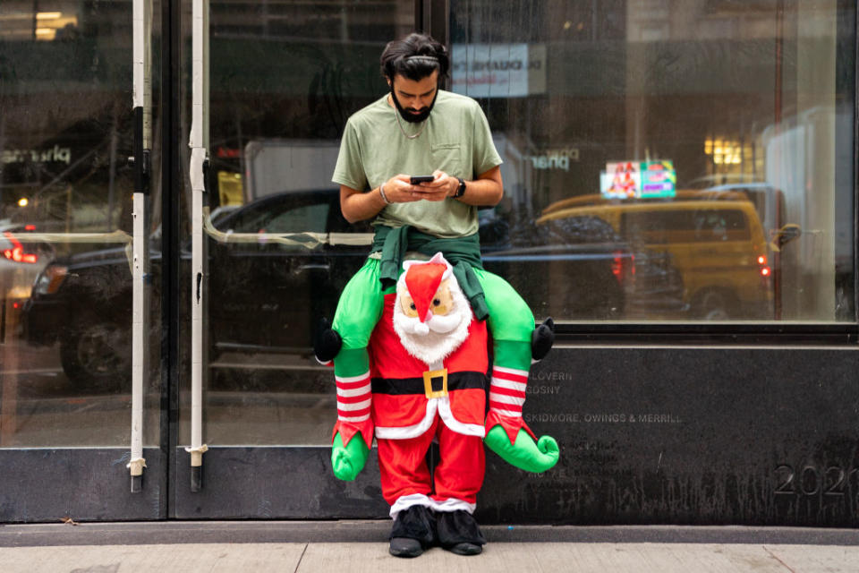 A person dressed in a holiday costume participates in SantaCon on in New York City. (Photo by David Dee Delgado/Getty Images)