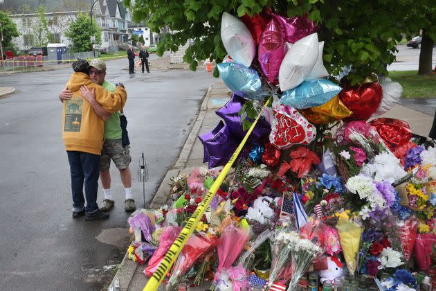 BUFFALO, NEW YORK - MAY 18:  People visit a makeshift memorial set up outside the Tops supermarket on May 18, 2022 in Buffalo, New York. A gunman opened fire at the store on Saturday, killing 10 people and wounding three others. Police say it's being investigated as a racially motivated hate crime.  (Photo by Scott Olson/Getty Images) (Photo: Scott Olson via Getty Images)