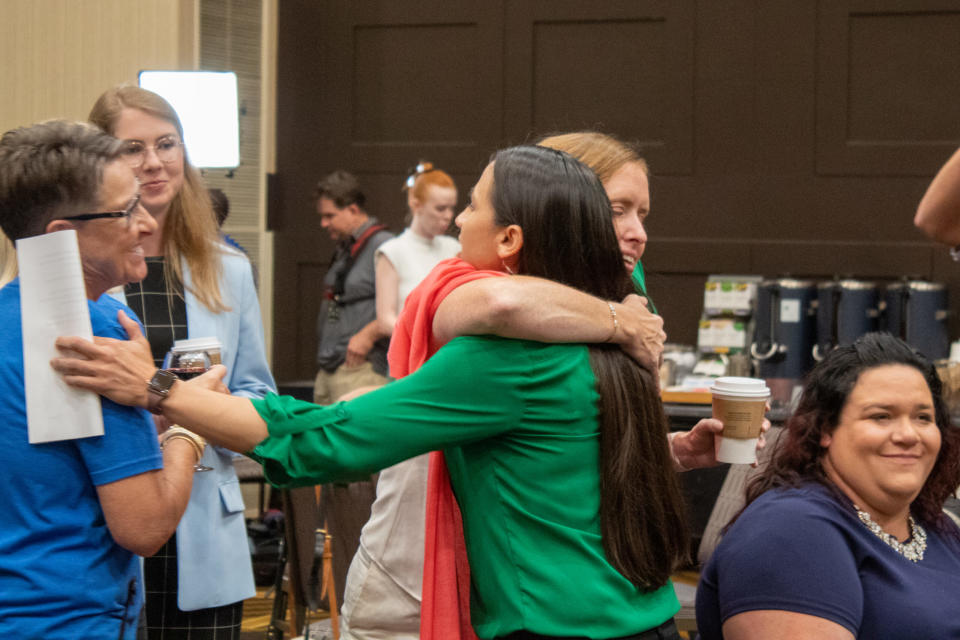 U.S. Rep. Sharice Davids, right, embraced Kansas Senate Minority Leader Dinah Sykes at an Aug. 2 primary election watch party in Overland Park. Davids won reelection to a third term Tuesday by defeating Republican Amanda Adkins. (Lily O'Shea Becker for the Kansas Reflector)