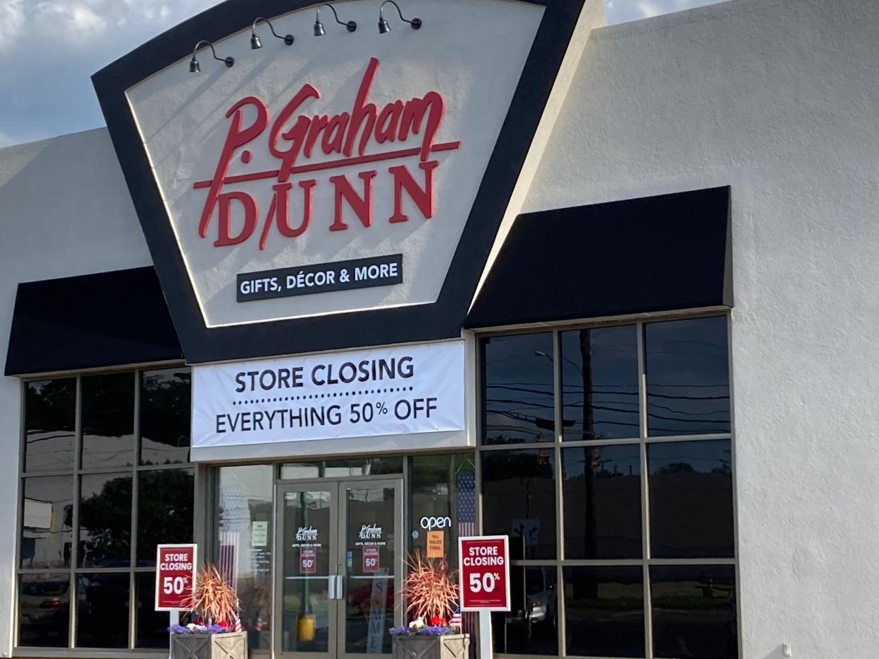 Signs announce plans to close the P. Graham Dunn on 30th Street NW in Canton. Officials at the Dalton-based company haven't responded to questions about the closing.