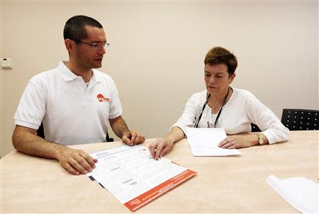 Nadav Kidron, CEO of Oramed Pharmaceuticals, and his mother, Oramed's chief scientific officer, Miriam Kidron (R), pose for a photo at the company's offices in Jerusalem September 29, 2013. REUTERS/Baz Ratner