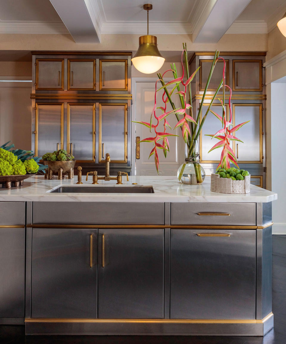 Kitchen with stainless steel cabinets and marble counter