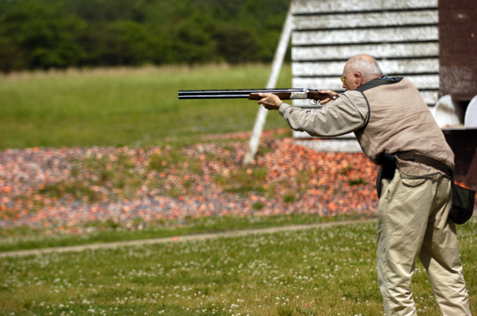 Dingell lines up a target on the skeet range in 2002 during the 10th Annual Great Congressional Shoot-Out at Prince George's Shooting Center in Glenn Dale, Maryland.