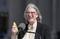 Patti Smith accepts the Michigan Central Honors on behalf of her husband, MC5 guitarist Fred Smith, Thursday, June 6, 2024, in Detroit. (AP Photo/Carlos Osorio)