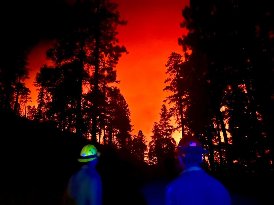 A view of the Campbell Fire on Aug. 8, with members of the Mad River Engine 343 crew on Peach Tree Road.