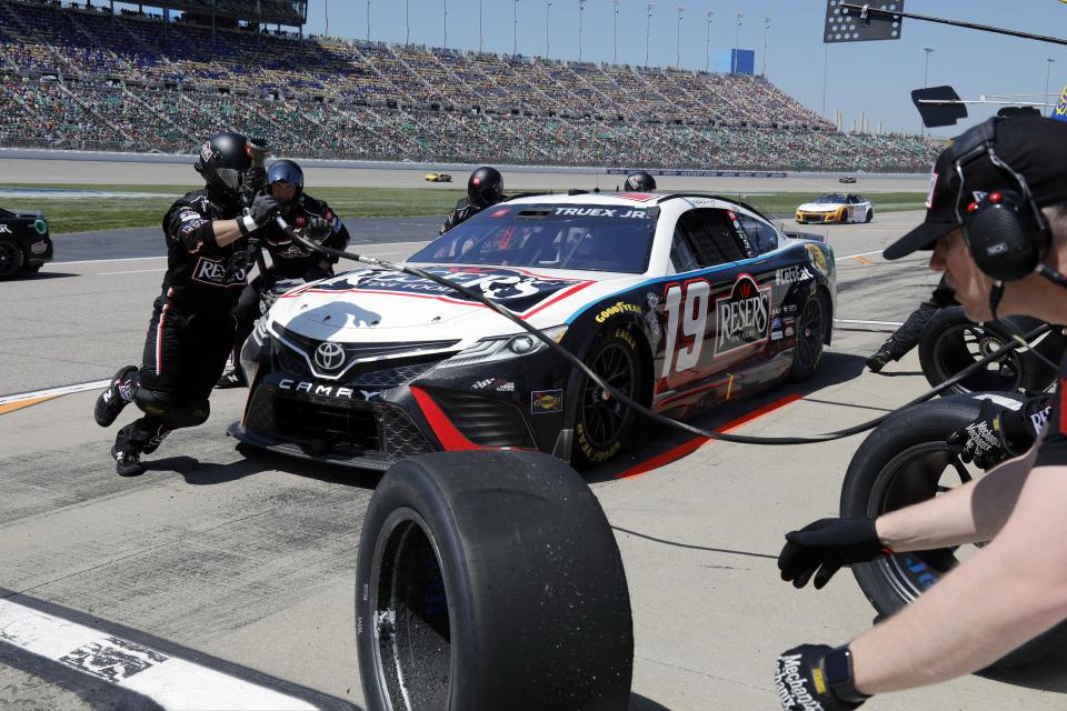 Martin Truex Jr. stops in pit road for a tire change during a NASCAR Cup Series auto race at Kansas Speedway in Kansas City, Kan., Sunday, May 7, 2023. (AP Photo/Colin E. Braley)
