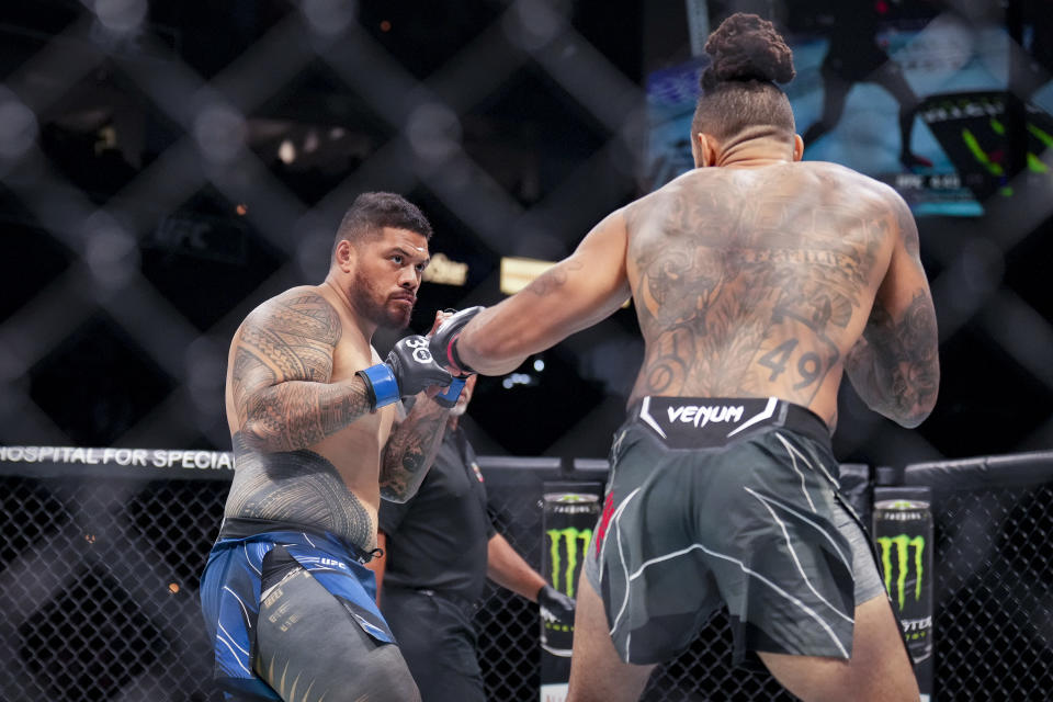 Jun 24, 2023; Jacksonville, Florida, USA; Austen Lane (red gloves) fights Justin Tafa (blue gloves) in a heavyweight bout during UFC Fight Night at VyStar Veterans Memorial Arena. Mandatory Credit: David Yeazell-USA TODAY Sports