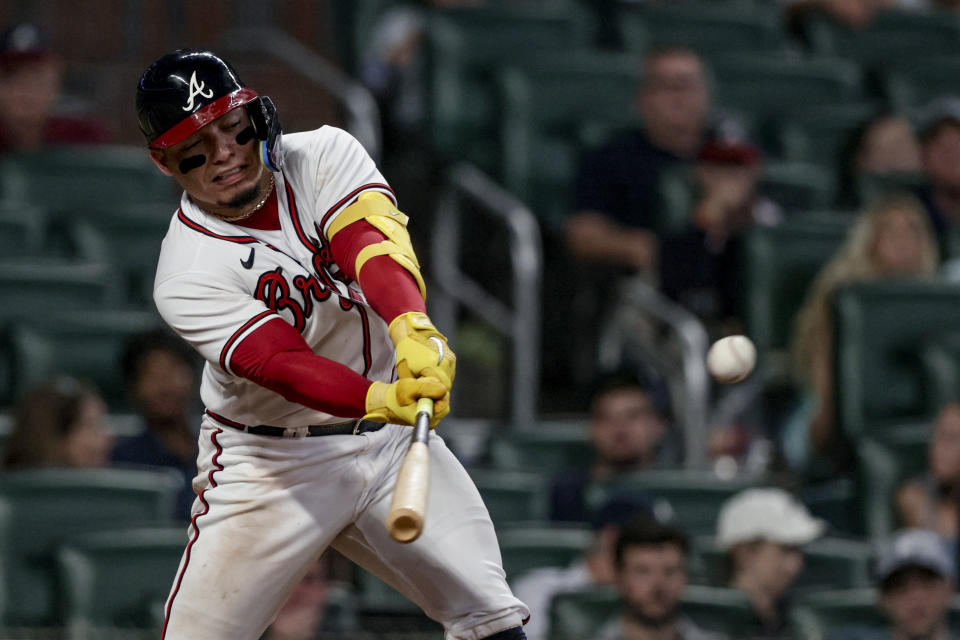 Atlanta Braves' William Contreras hits a single against the Arizona Diamondbacks during the eighth inning of a baseball game, Saturday, July 30, 2022, in Atlanta. (AP Photo/Butch Dill)