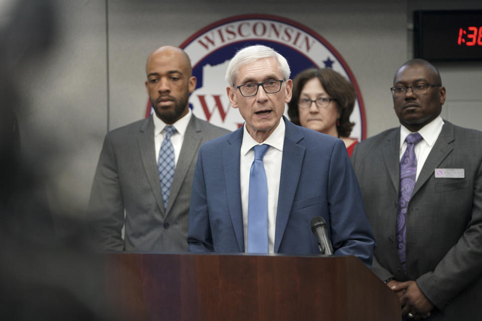 FILE - In this March 12, 2020, file photo Gov. Tony Evers declares a public health emergency in response to a growing number of cases of COVID-19 in Wisconsin. Across an arc of vital swing states, the coronavirus has put politics on an uneasy pause. Political fights are raging among state leaders from Iowa to Pennsylvania over the handling of the pandemic’s impact. (Steve Apps/Wisconsin State Journal via AP, File)