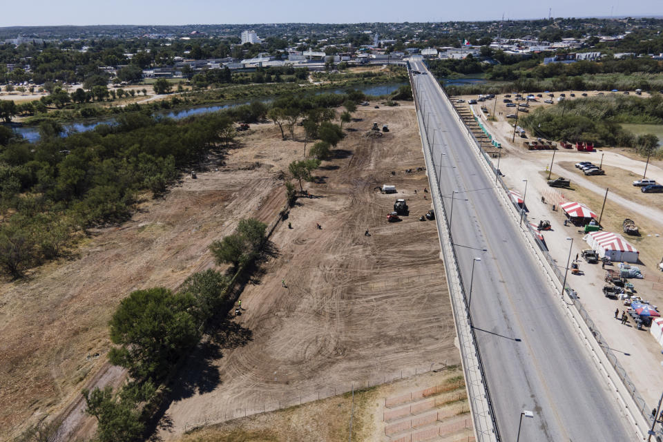 An area where migrants, many from Haiti, were encamped is seen after crews cleared the zone along the Del Rio International Bridge, Friday, Sept. 24, 2021, in Del Rio, Texas. (AP Photo/Julio Cortez)