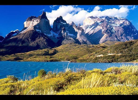 Located in Patagonia, the southern region of Chile, Torres del Paine National Park is considered by many to be one of the most beautiful places on earth. Its spectacular mountain peaks, crystal clear lakes, and rushing rivers are huge draw for backpackers, who come from all over to explore the park's natural wonders, such as Lago Pehoe, an incredible crystal blue lake formed from a melting glacier.    Day hikes offer a taste of what Torres del Paine has to offer, but to really experience the place, you'll want to devote more time. The popular "W" trail takes approximately five days to finish, while the full Paine circuit requires upwards of nine days to complete. Be sure to book one of the "<a href="http://www.fantasticosur.com/en/" target="_hplink">Refugios</a>" (beds from $40)  well in advance.    <strong>Getting There</strong>: Take the two-hour bus ride from Puerto Natales to the trailhead. There are buses to Natales from Punta Arenas further to the south, which is in turn accessible on domestic flights aboard <a href="http://www.lan.com/es_cl/sitio_personas/index.html" target="_hplink">LAN Airline</a>s for around $240 round trip.    Photo: Kraig Becker/HuffPost Travel