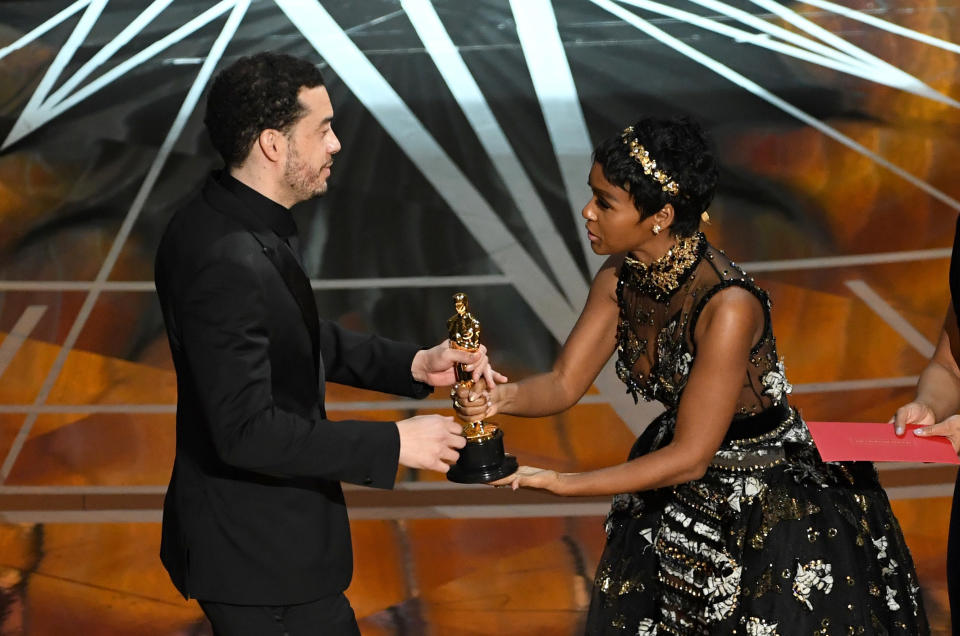 Director Ezra Edelman accepts Best Documentary Feature for "O.J.: Made in America" from actor/singer Janelle Monae onstage during the 89th Annual Academy Awards at Hollywood &amp; Highland Center on Feb. 26, 2017 in Hollywood, California.&nbsp;