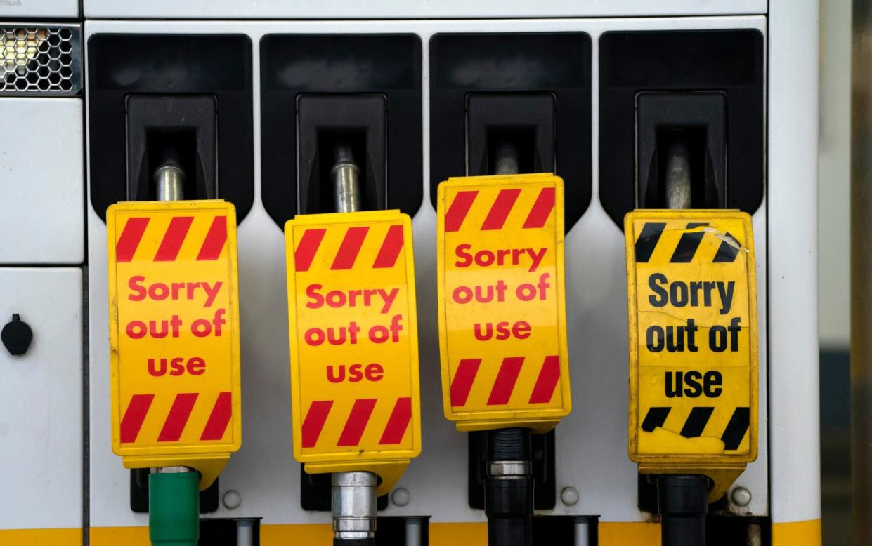 Closed petrol pumps at a petrol station in Manchester - AP