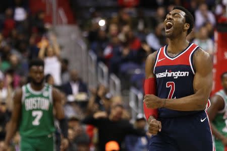 FILE PHOTO - Apr 10, 2018; Washington, DC, USA; Washington Wizards guard John Wall (2) reacts after a three point field goal by Wizards forward Kelly Oubre Jr. (not pictured) against the Boston Celtics in the fourth quarter at Capital One Arena. Mandatory Credit: Geoff Burke-USA TODAY Sports