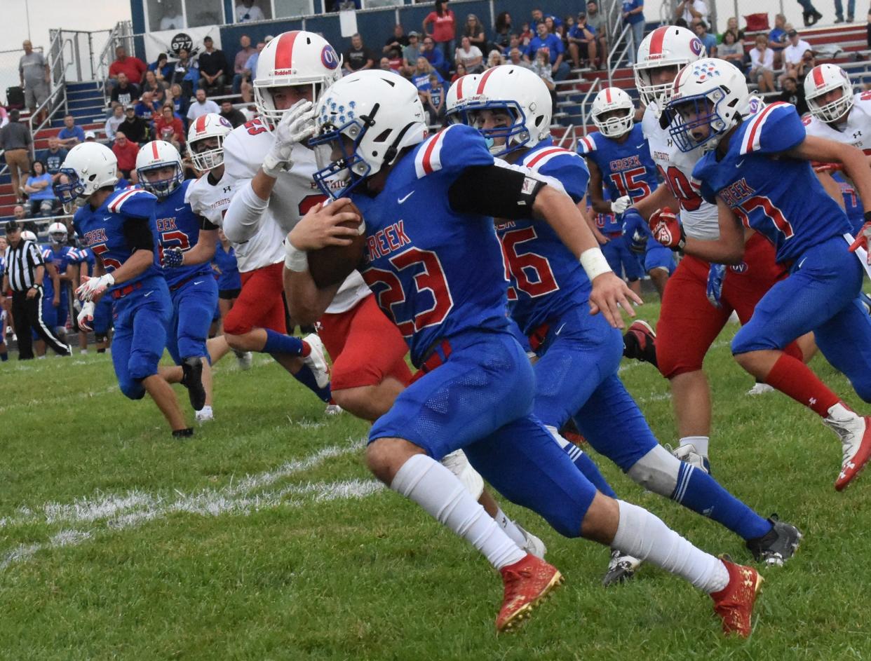 Off to the races... Indian Creek's Brandon Murray scurries for big yardage.