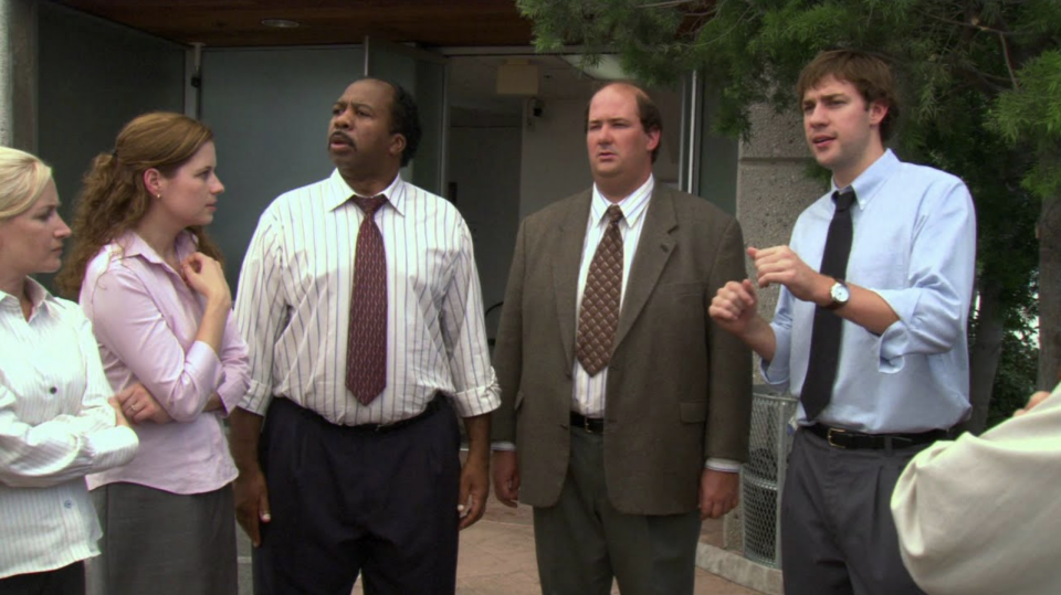 Jim talking to coworkers outside