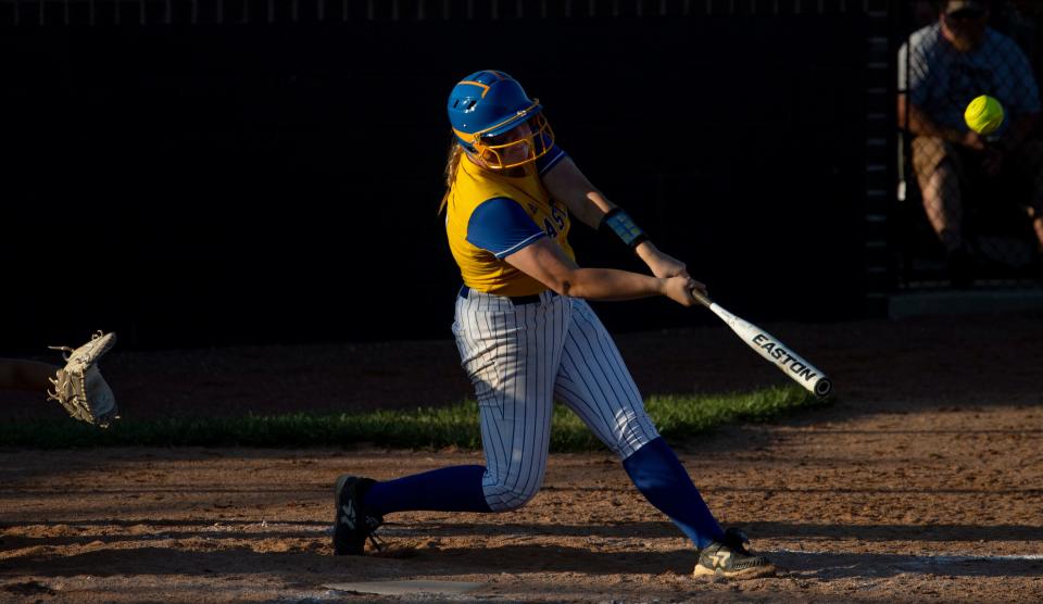 Castle's Brooklyn Ballis (22) drives a ball to the fence for her second double of the game against Central during their sectional championship game at North High School Saturday evening, May 28, 2022.