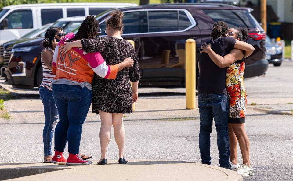 Friends and relatives of Zachary Capers console each other outside the Madison County Criminal Justice Center in Edwardsville on Tuesday after Capers pleaded guilty but mentally ill to first-degree murder. Jimmy Simmons