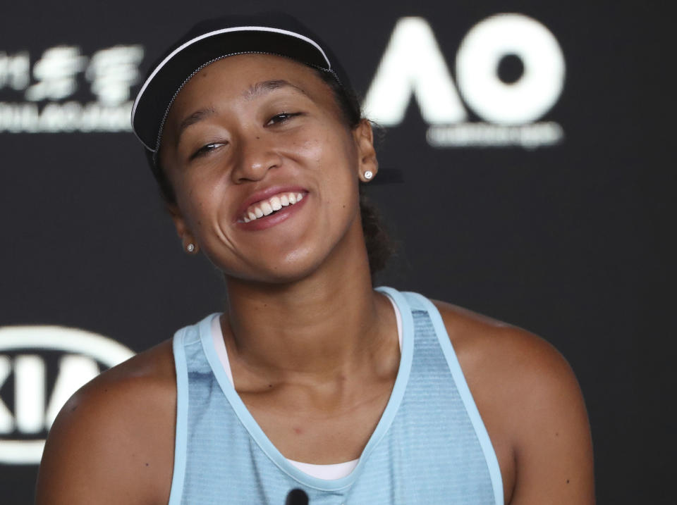 Japan's Naomi Osaka smiles during a press conference ahead of the Australian Open tennis championships in Melbourne, Australia, Saturday, Jan. 12, 2019. (AP Photo/Mark Schiefelbein)