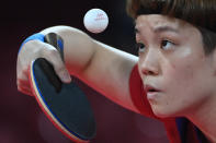 <p>Hong Kong's Doo Hoi-kem competes during their women's team round of 16 table tennis match at the Tokyo Metropolitan Gymnasium during the Tokyo 2020 Olympic Games in Tokyo on August 1, 2021. (Photo by ADEK BERRY / AFP)</p> 