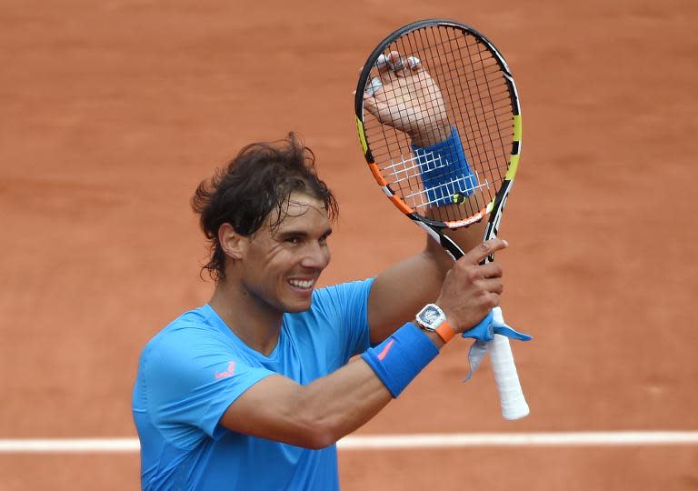 Spain's Rafael Nadal celebrates after defeating France's Quentin Halys during the men's first round at the Roland Garros 2015 French Tennis Open in Paris on May 26, 2015