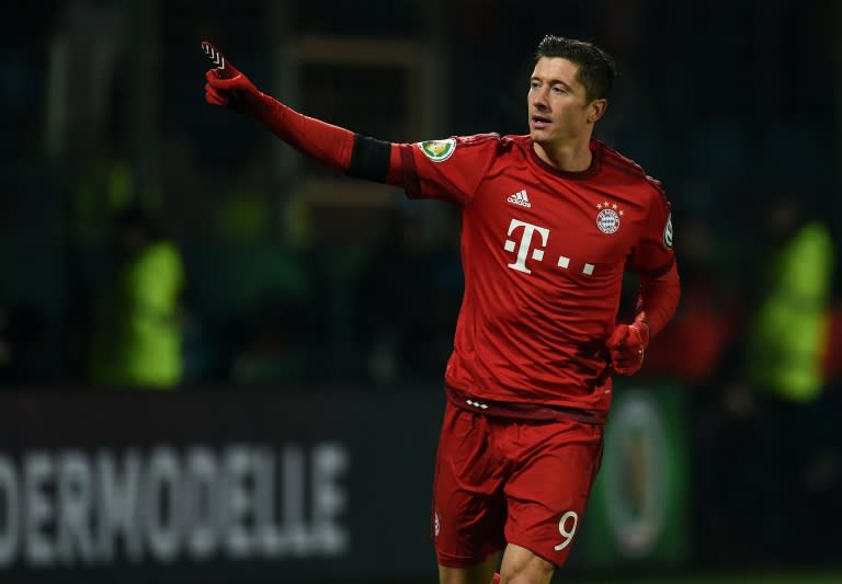 Bayern Munich's striker Robert Lewandowski celebrates scoring during the German Cup quarter final football match Vfl Bochum v Bayern Munich on February 10, 2016 in Bochum, western Germany