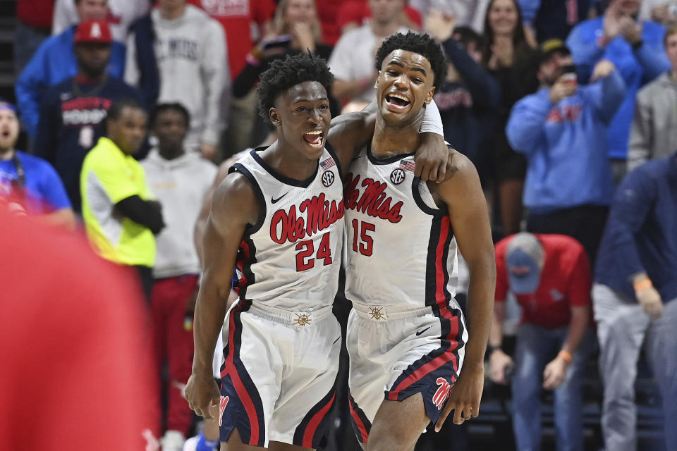 Mississippi guard Jarkel Joiner (24) and forward Luis Rodriguez (15) react during the final minutes of an NCAA college basketball game against Memphis in Oxford, Miss., Saturday, Dec. 4, 2021. Mississippi won 67-63. (AP Photo/Thomas Graning)