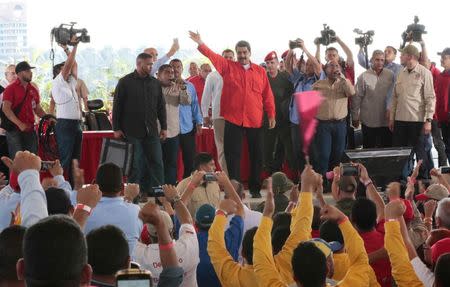 Venezuela's President Nicolas Maduro (C) greets workers during a meeting at the Francisco de Miranda hydroelectric complex in Caruachi, Venezuela July 6, 2017. Miraflores Palace/Handout via REUTERS
