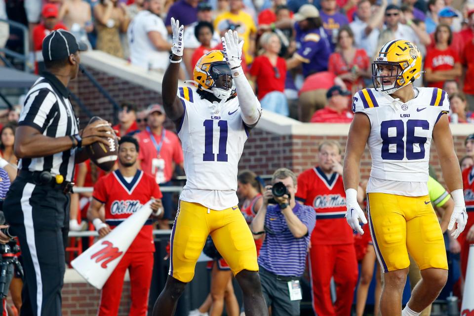 Sep 30, 2023; Oxford, Mississippi, USA; LSU Tigers wide receiver Brian Thomas Jr. (11) reacts after a touchdown during the first half against the Mississippi Rebels at Vaught-Hemingway Stadium. Mandatory Credit: Petre Thomas-USA TODAY Sports
