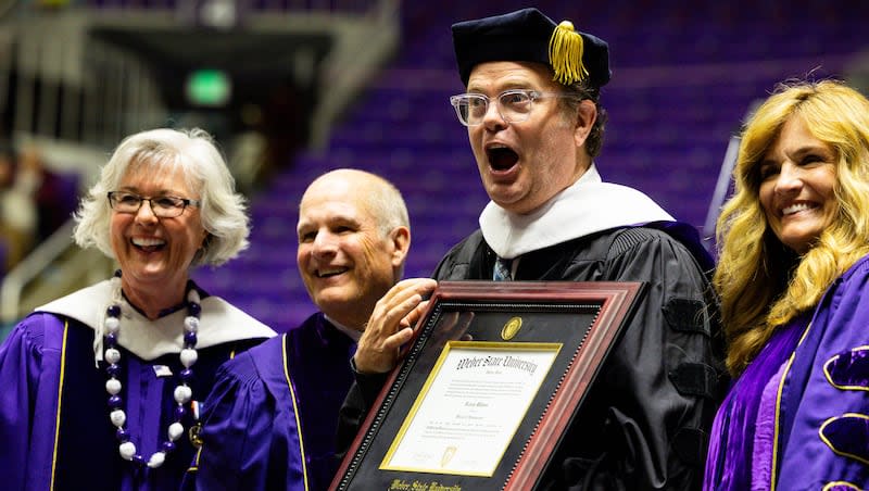 Weber State University faculty honor actor Rainn Wilson with an honorary doctoral degree at Weber State University’s commencement program at the Dee Events Center in Ogden on Friday, April 26, 2024.