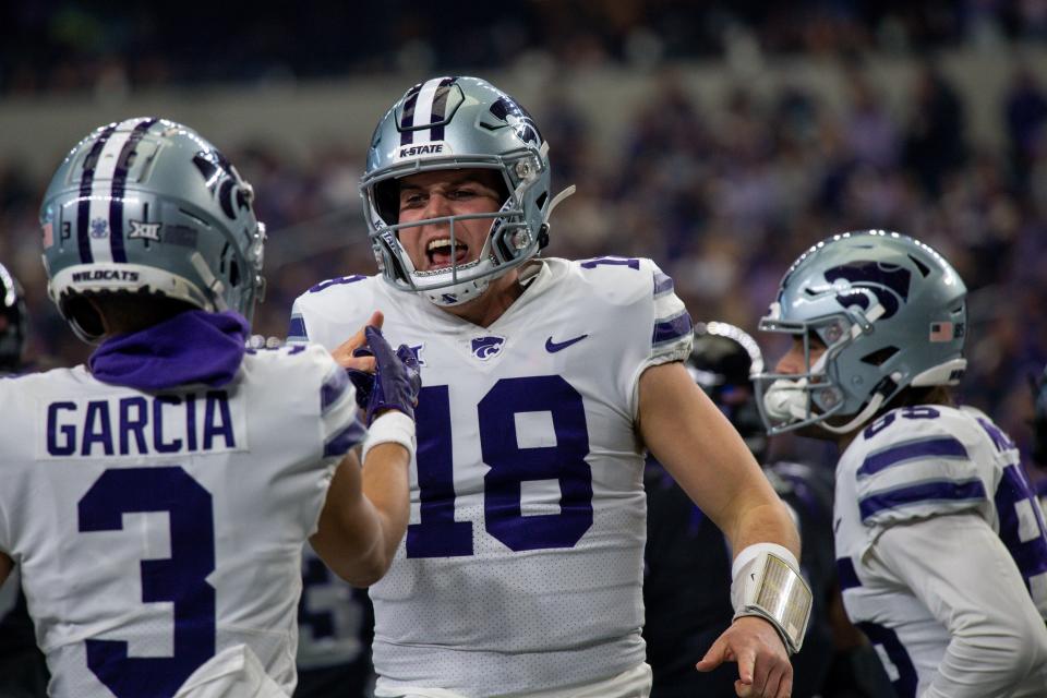 Kansas State quarterback Will Howard (18) celebrates a touchdown with wide receiver RJ Garcia (3) during last year's Big 12 championship game at AT&T Stadium in Arlington, Texas.
