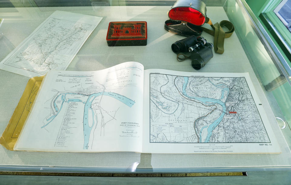 In this Dec. 18, 2012 photograph, visitors can see a book of river maps and charts in the pilot house of the Motor Vessel Mississippi IV at the Lower Mississippi River Museum in Vicksburg, Miss. The museum provides visitors with a extensive look at life surrounding the Mississippi River through several centuries by way of its interactive and static displays. (AP Photo/Rogelio V. Solis)