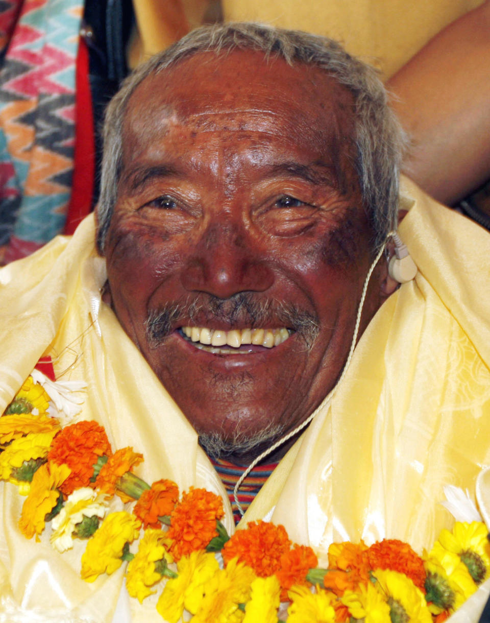 FILE - In this May 31, 2008 file photo, Min Bahadur Sherchan, who became the oldest person to climb Mount Everest on May 25, 2008 smiles on his arrival in Katmandu, Nepal. Yuichiro Miura, an 80-year-old Japanese extreme skier who just missed becoming the oldest man to reach the summit of Mount Everest five years ago is back on the mountain to make another attempt at the title. Unfortunately for Miura, Sherchan, the slightly older man who nabbed the record a day before he could in 2008 is fast on his heels. (AP Photo/Binod Joshi, File)