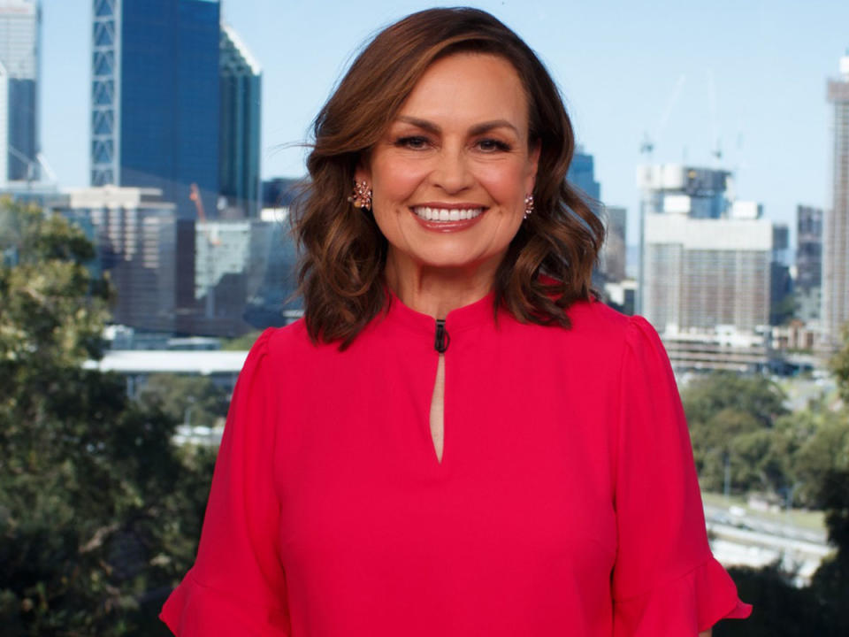 Lisa Wilkinson wearing a red top on the set of The Project