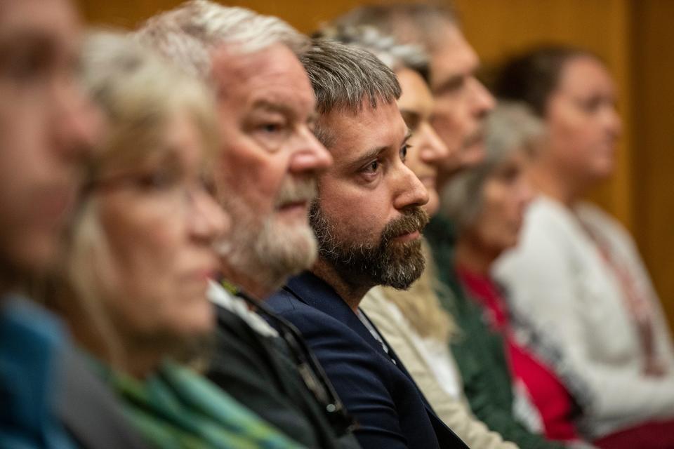 Todd Baylis surrounded by family members listens as the jury recommends the death penalty for Marcelle Waldon.