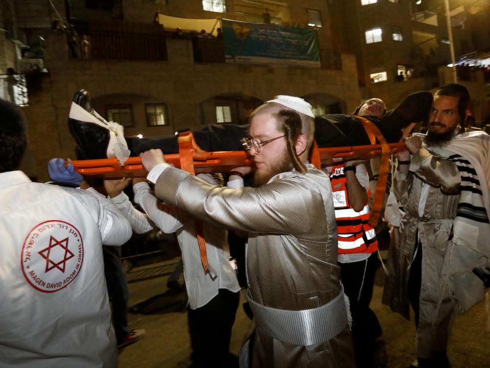 Israeli emergency services continue to transport those injured in the fall (AFP via Getty Images)