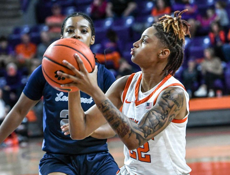 Clemson freshman guard Ruby Whitehorn (22) shoots near Longwood guard Bailey Williams (2) during the first quarter at Littlejohn Coliseum in Clemson, S.C. Sunday, November 19, 2023.