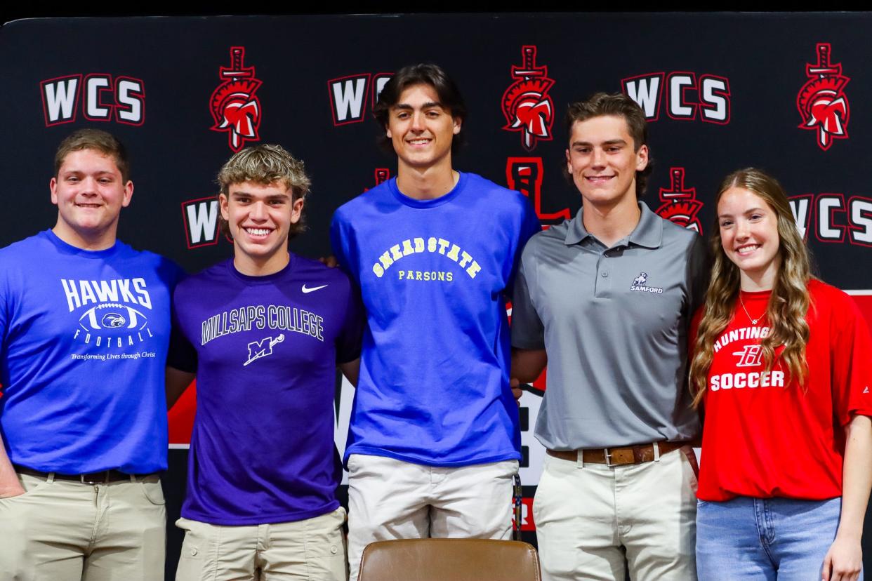 Westbrook Christian students pose after signing to play at the next level.