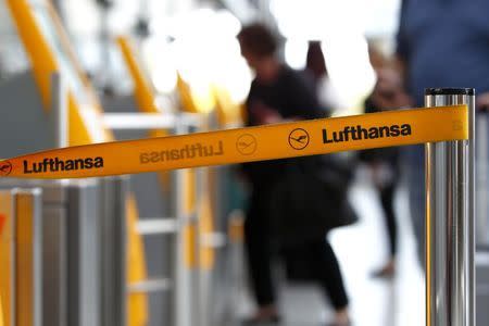 A barrier tape of German airline Lufthansa is seen at Munich airport October 20, 2014. REUTERS/Michaela Rehle