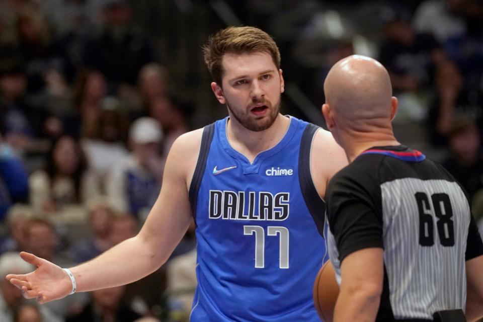 Dallas Mavericks guard Luka Doncic (77) questions a call by referee Jacyn Goble (68) during the first quarter of an NBA basketball game against the Detroit Pistons in Dallas, Tuesday, Feb. 8, 2022.