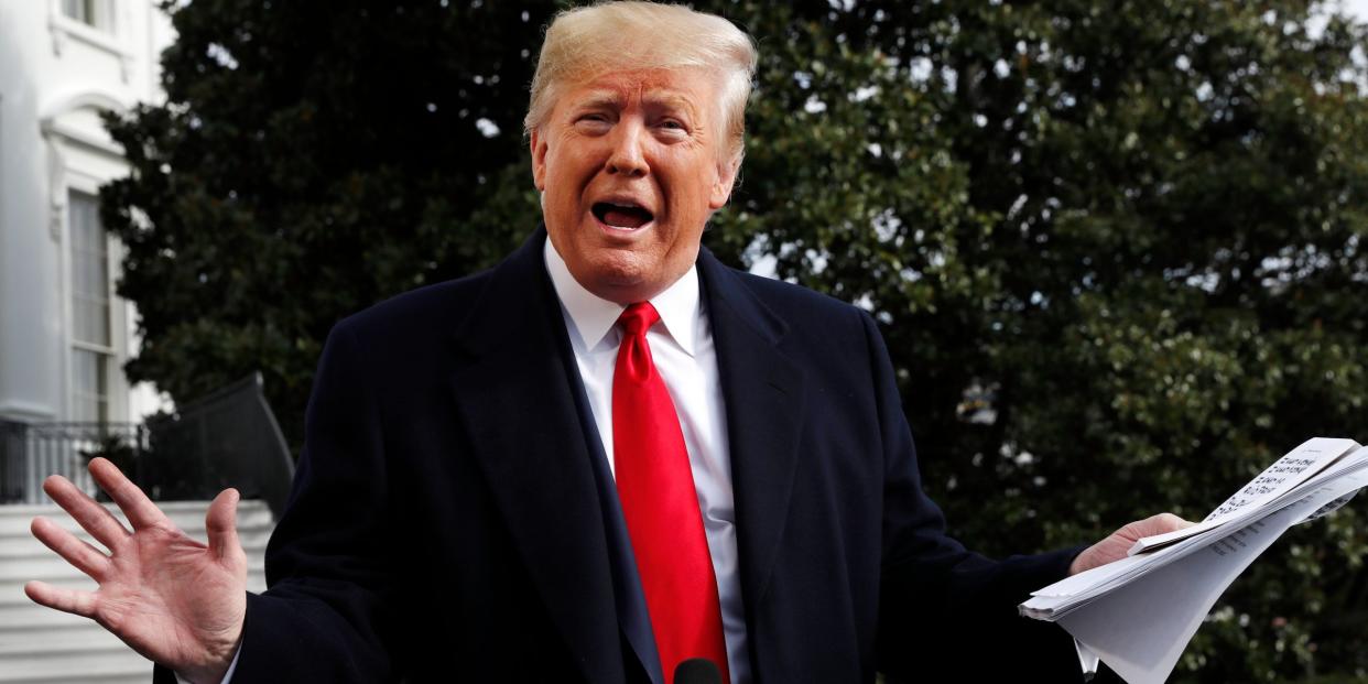 President Donald Trump holds handwritten notes as he speaks to the media about the House Intelligence Committee testimony of U.S. Ambassador to the European Union Gordon Sondland, Wednesday, Nov. 20, 2019, as Trump leaves the White House in Washington, en route to Texas. (AP Photo/Jacquelyn Martin)