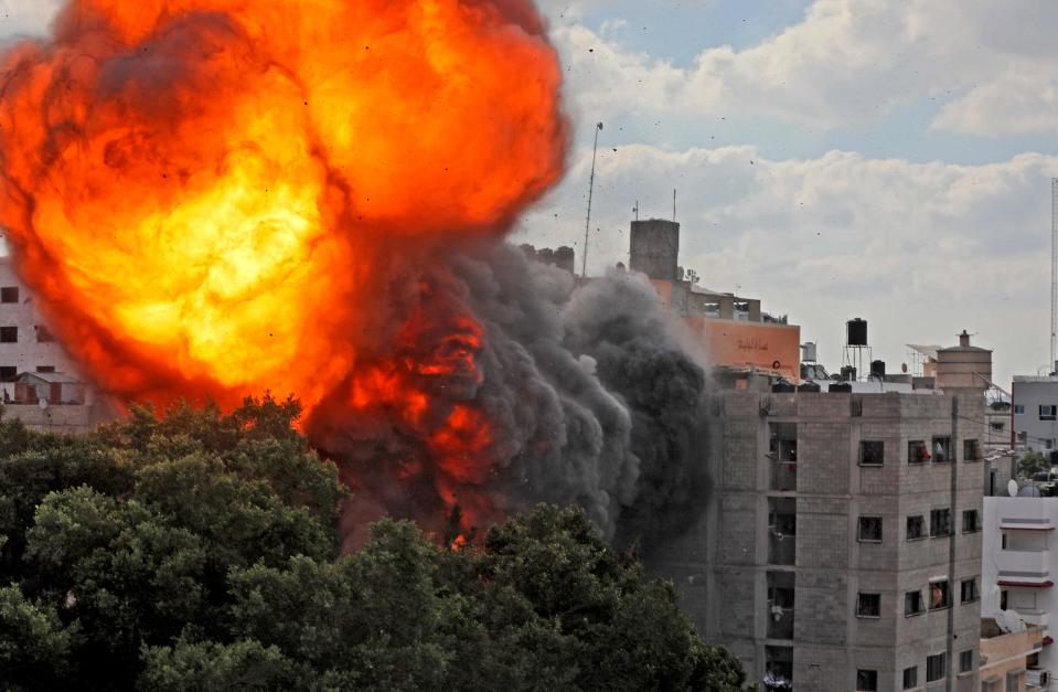 A picture taken Thursday shows a ball of fire engulfing the Al-Walid building, which was destroyed in an Israeli airstrike on Gaza city early in the morning. An Israeli strike destroyed another multi-story building in Gaza City the previous night, as the Jewish state continued its heavy bombardment of the Palestinian enclave.