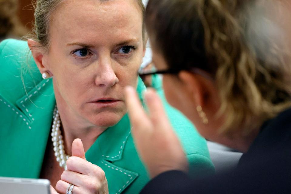 Assistant Public Defender Melisa McNeill, left, speaks with Assistant Public Defender Nawal Bashimam during jury selection in the penalty phase of the trial of Marjory Stoneman Douglas High School shooter Nikolas Cruz (AP)