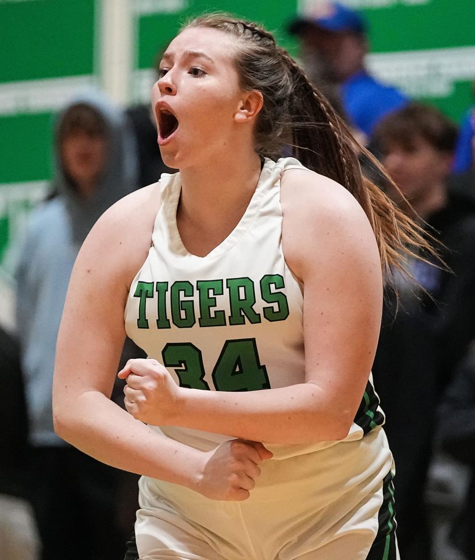 Triton Central Tigers center Brooklyn Bailey (34) yells in excitement Tuesday, Jan. 31, 2023 at Triton Central High School in Fairland. The Eastern Hancock Royals defeated the Triton Central Tigers, 49-44. 