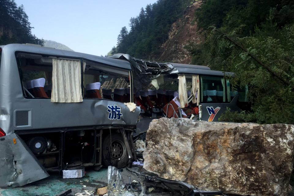 <p>A tour bus damaged during an earthquake is seen in Jiuzhaigou in China’s southwestern Sichuan province on Aug. 9, 2017. (Photo: STR/AFP/Getty Images) </p>