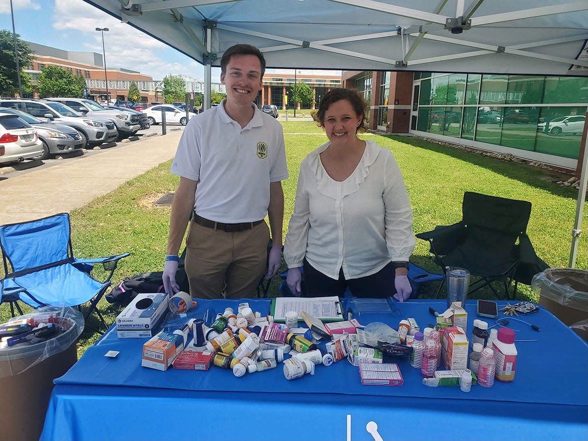 Chipper Smith, left, senior project coordinator in the Middle Tennessee State University Office of Prevention Science and Recovery, and MTSU Pharmacist Tabby Ragland are shown with a portion of nearly 77 pounds of medications collected Wednesday, April 24, during the spring Prescription Drug Take-Back Day held near the Campus Pharmacy drive-thru outside the Health, Wellness and Recreation Center on Blue Raider Drive in Murfreesboro, Tenn. The drive included collecting 60 vapes.