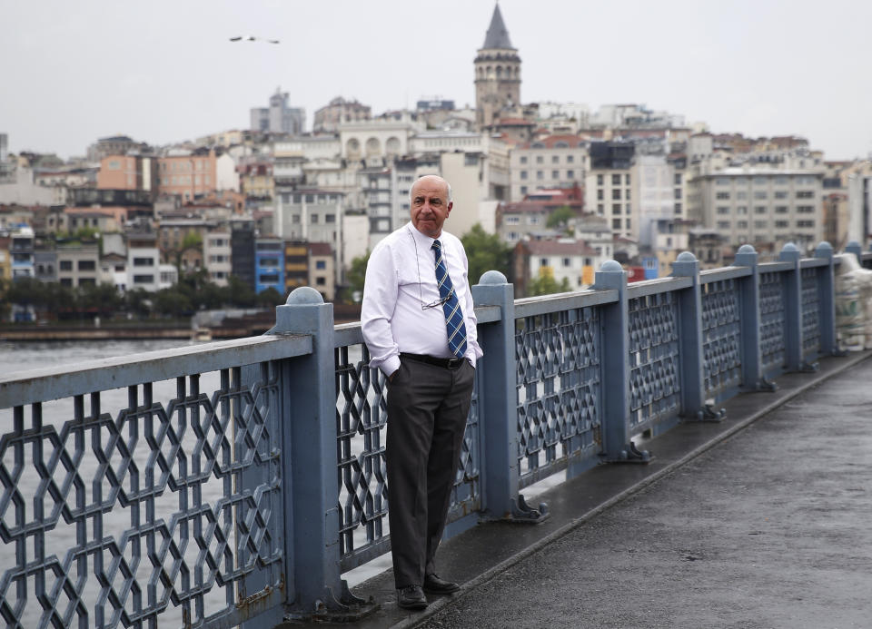 FILE-In this Tuesday, May 7, 2019 file photo, a man stands on Galata Bridge over the Golden Horn in Istanbul, following the announcement by Turkey's top electoral body that annulled the results of the March 31 vote in Istanbul. Millions of voters in Istanbul go back to the polls for a controversial mayoral election re-run Sunday, as President Recep Tayyip Erdogan's party tries to wrest back control of Turkey's largest city. (AP Photo/Lefteris Pitarakis, File)