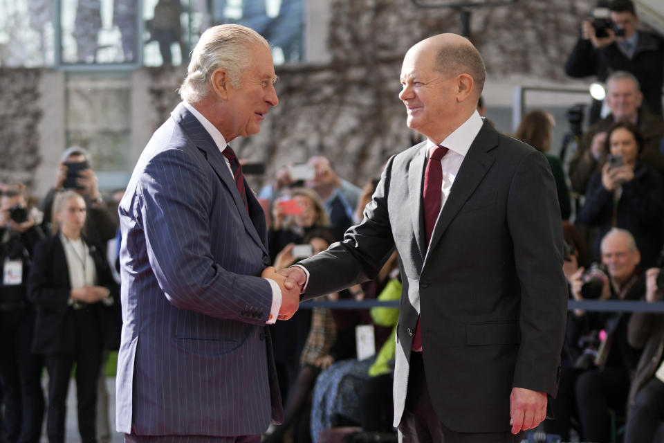 German Chancellor Olaf Scholz welcomes Britain's King Charles III at the chancellery in Berlin, Thursday, March 30, 2023. King Charles III arrived Wednesday for a three-day official visit to Germany. (AP Photo/Matthias Schrader)