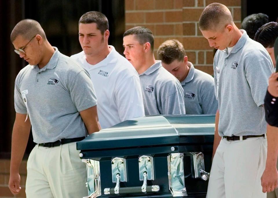 Pallbearers carry the casket of Columbine High School student, Matthew Kechter, out of St. Frances Cabrini Catholic Church in Littleton, one week after the 1999 shooting (AP 1999)